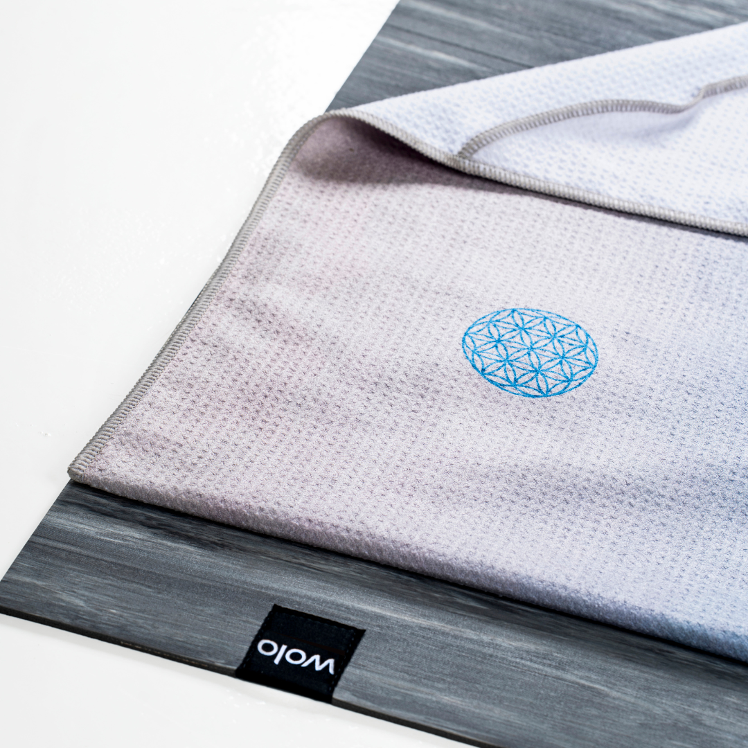 blue yoga towel on top of a grey yoga mat#color_lunar radiance
