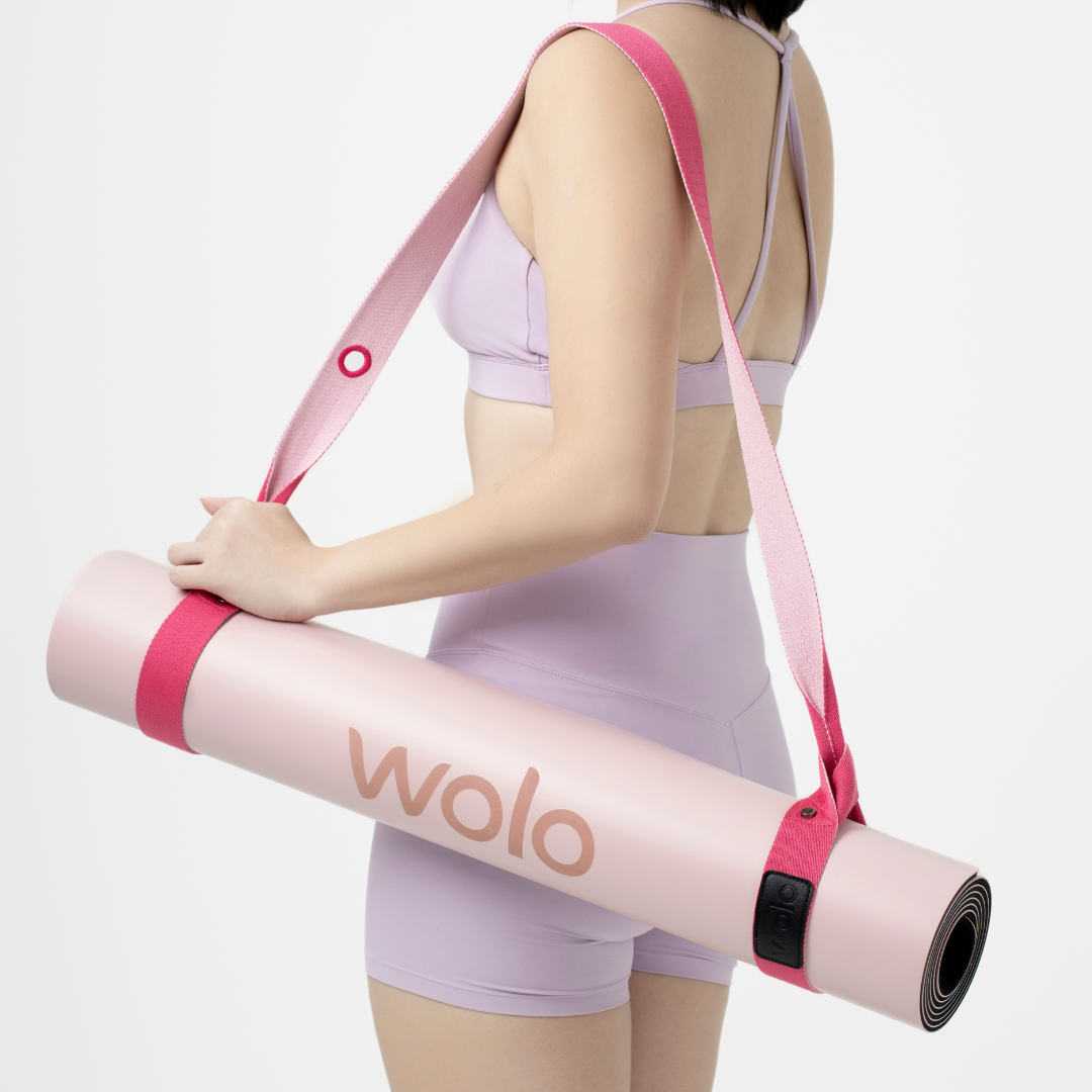 lady carry a pink yoga mat with pink yoga mat strap#color_lemonade pink
