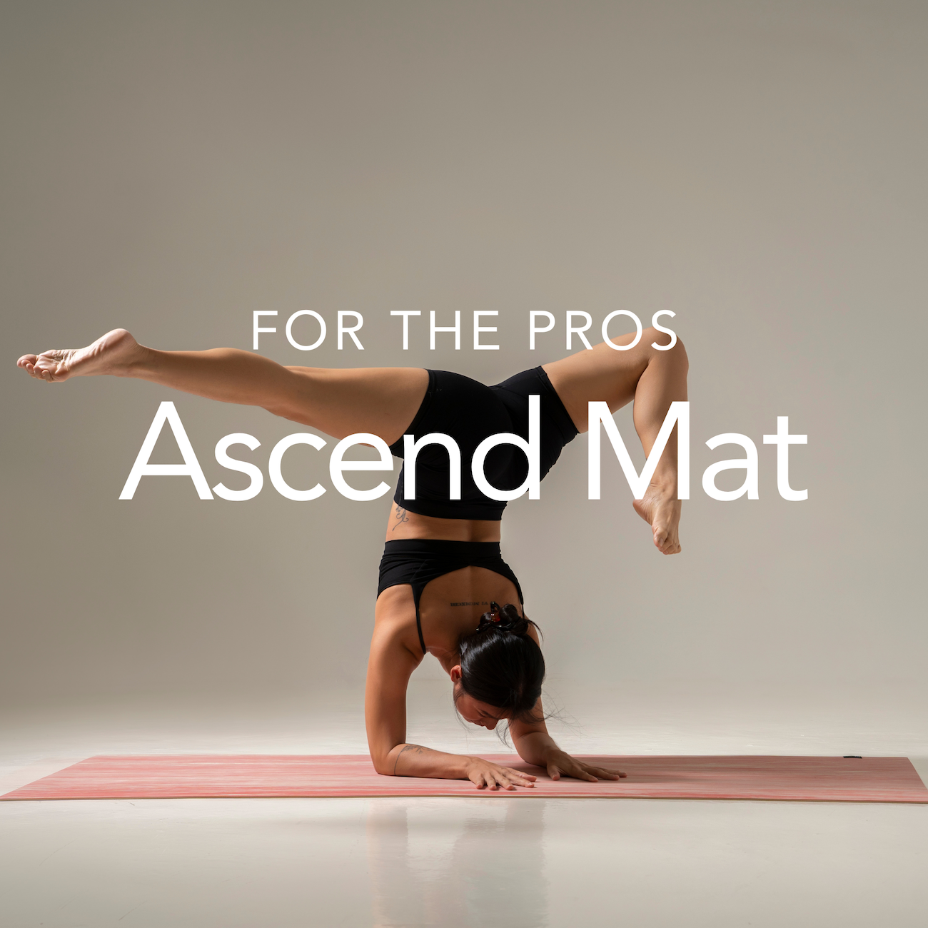 yoga teacher forearm stand on Ascend mat