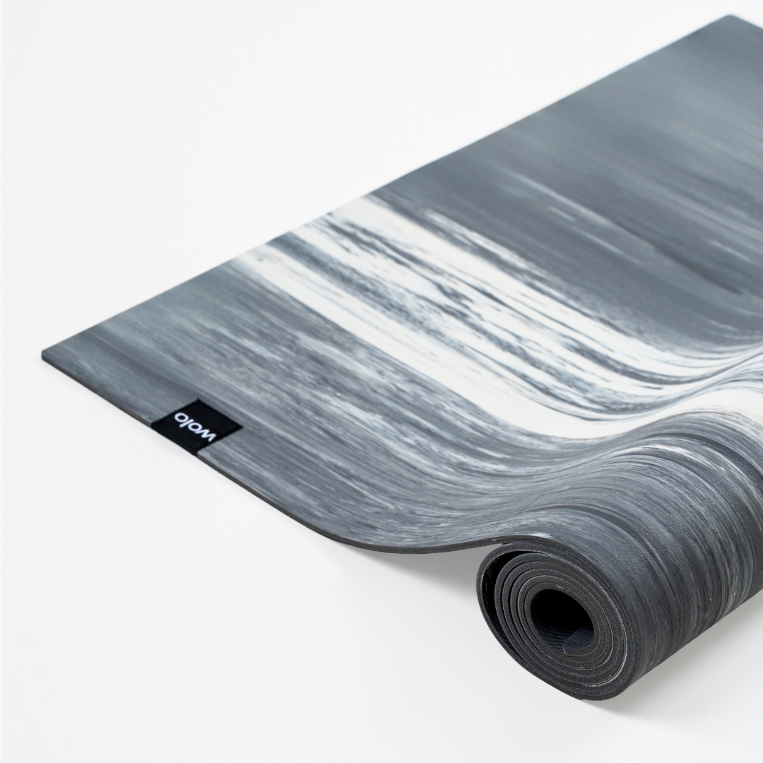 Marble-patterned yoga mat with a brand logo on a white background#color_limestone grey