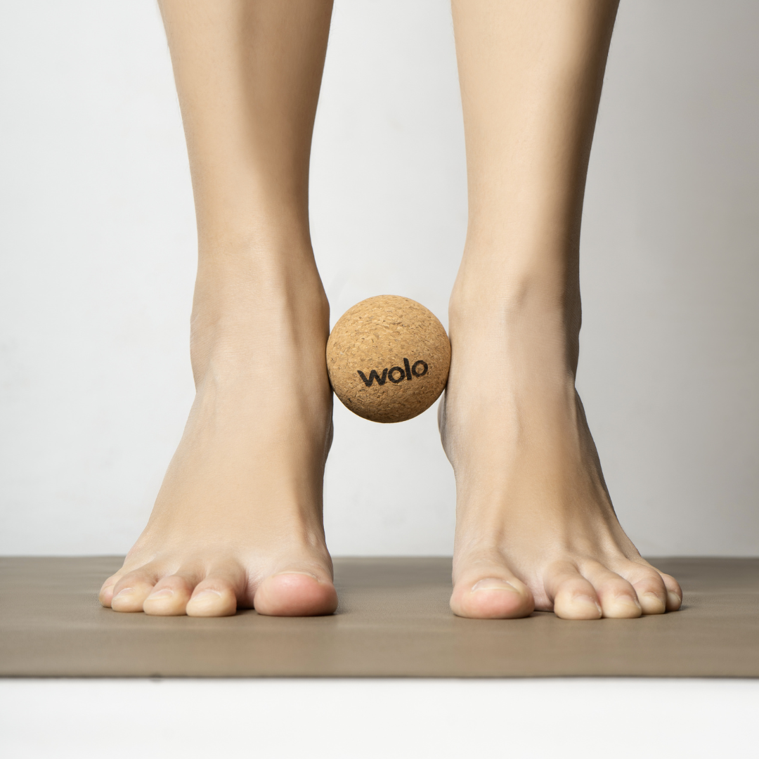 Release ankle tension using a cork massage ball