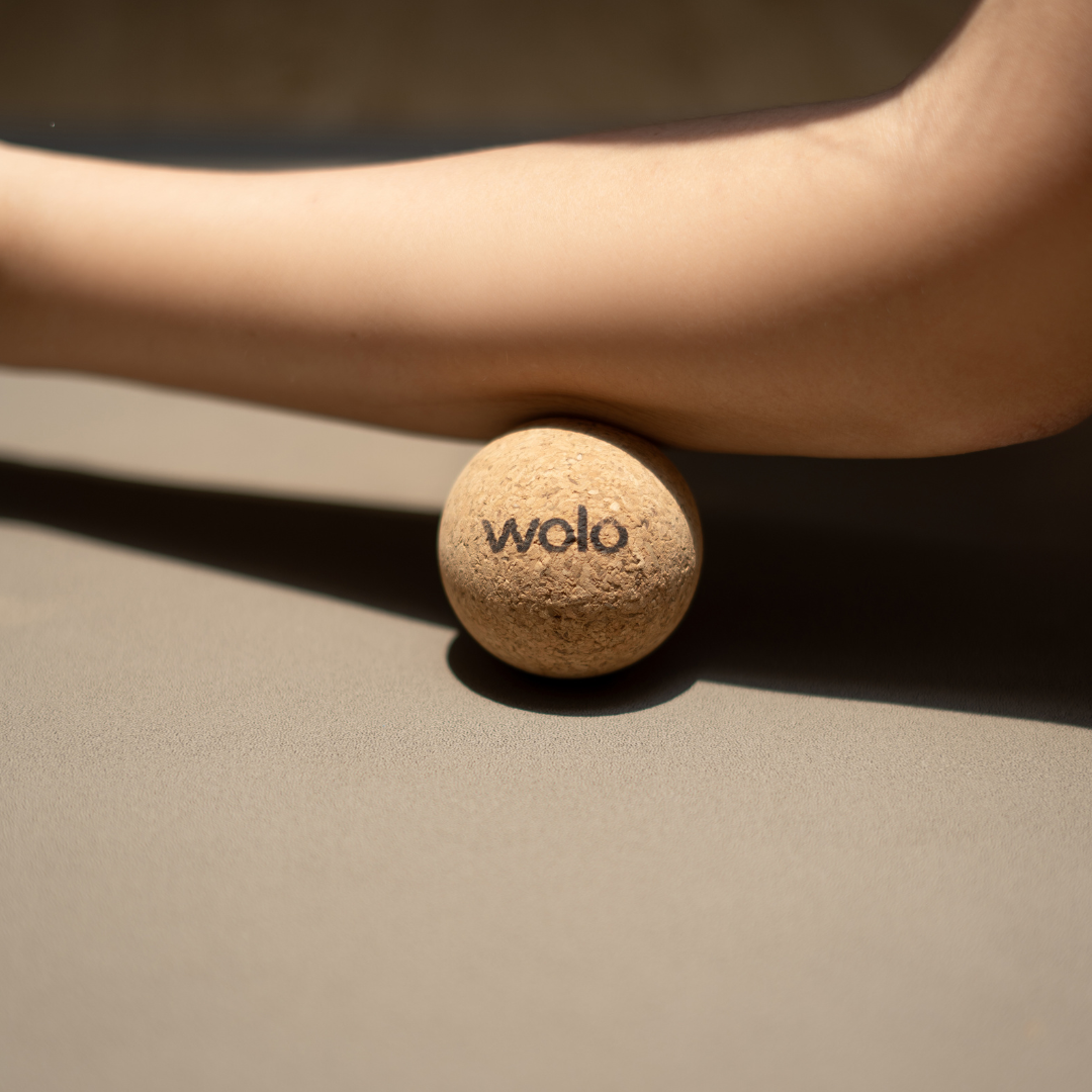 Release arm tension using a cork massage ball