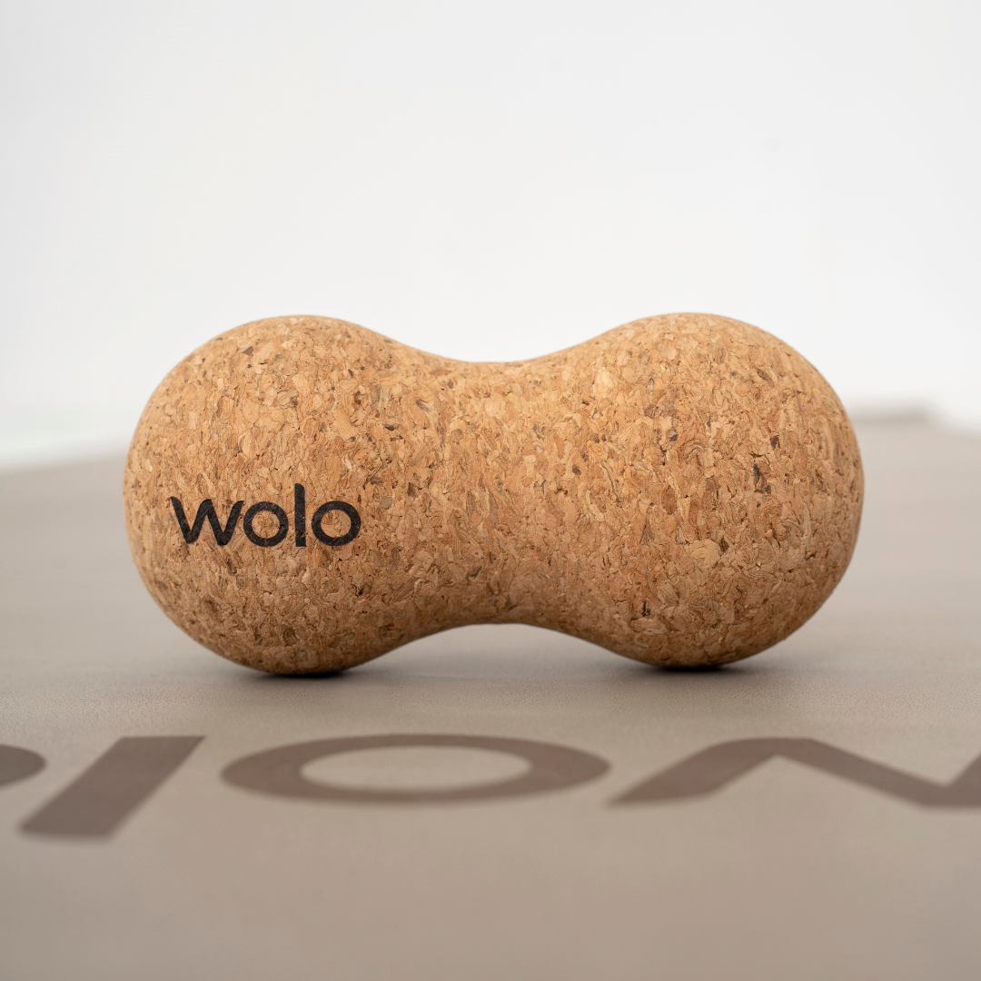 Cork peanut massage ball on Wolo yoga mat