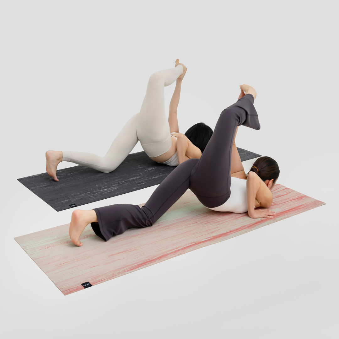 Two people practicing yoga on Wolo Yoga natural rubber yoga mats