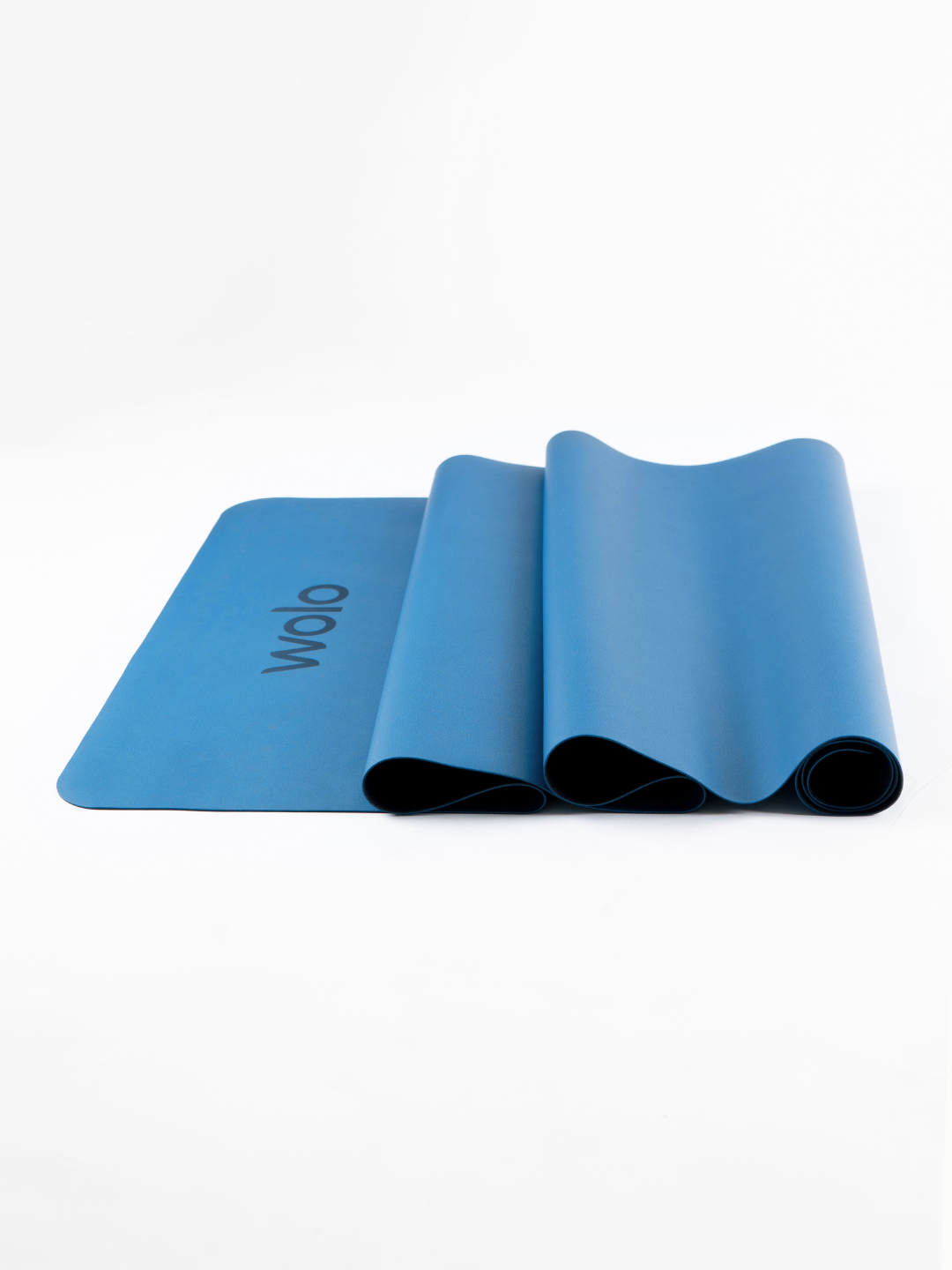 Close-up view of an Ocean blue foldable travel yoga mat