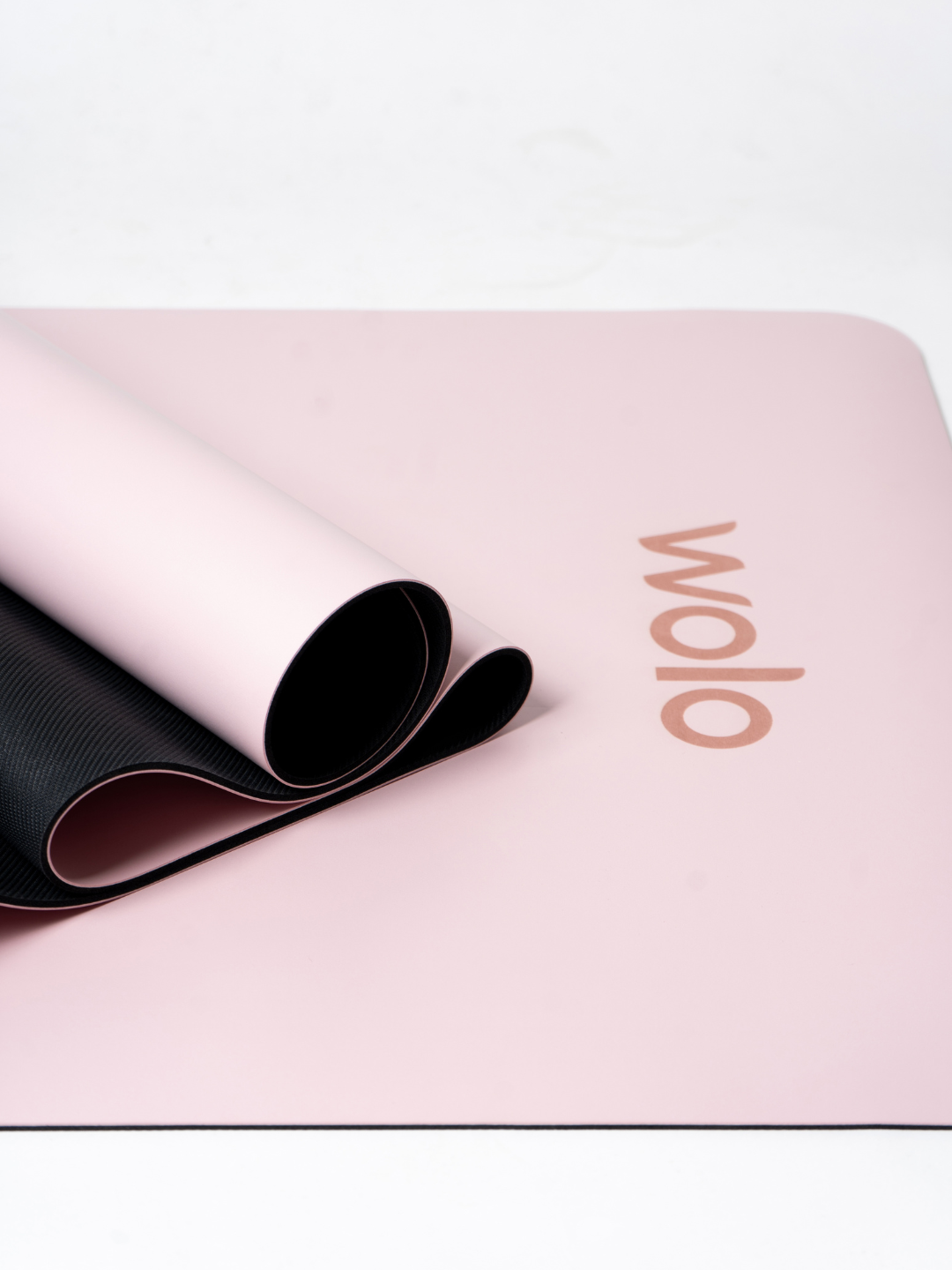 Close-up view of a Sakura pink yoga mat