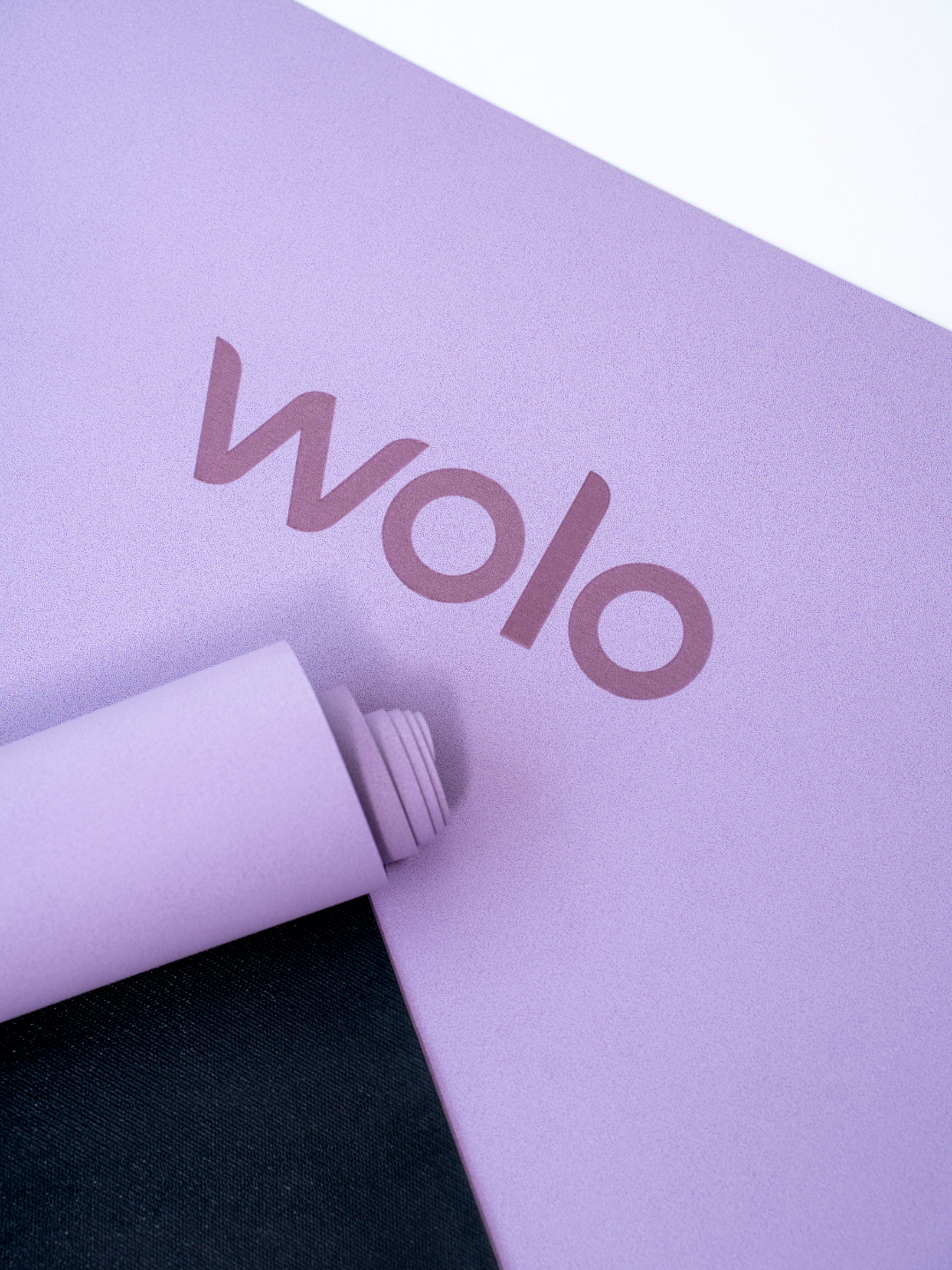 Close-up of a  purple foldable travel yoga mat