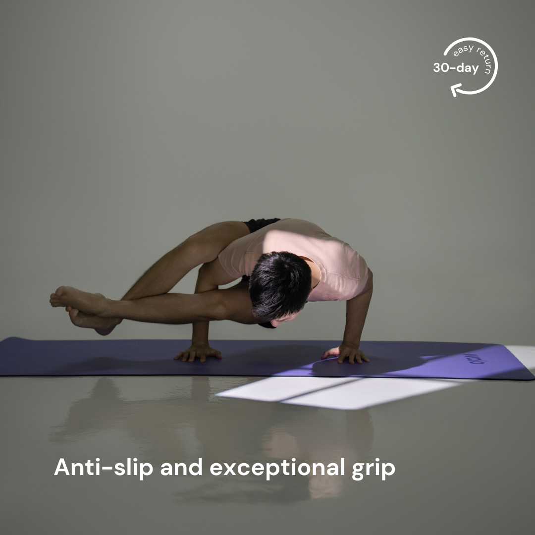 man practice eight-angle pose on the lilac purple yoga mat