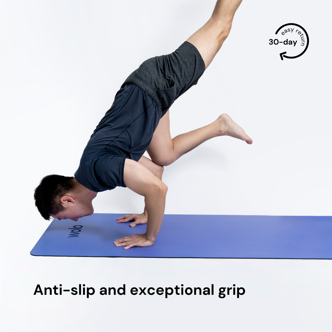 Man handstand on the lilac purple yoga mat