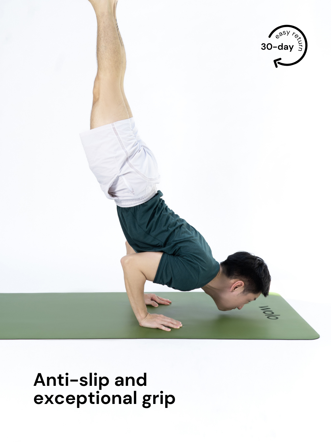 Man doing handstand on a sage green yoga mat