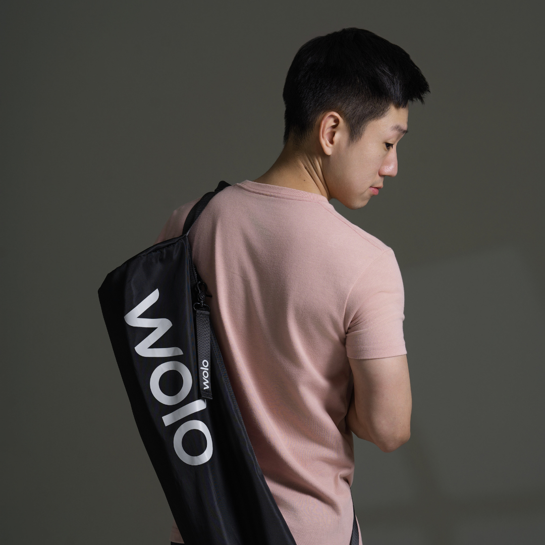 men carrying the wolo journey yoga mat bag