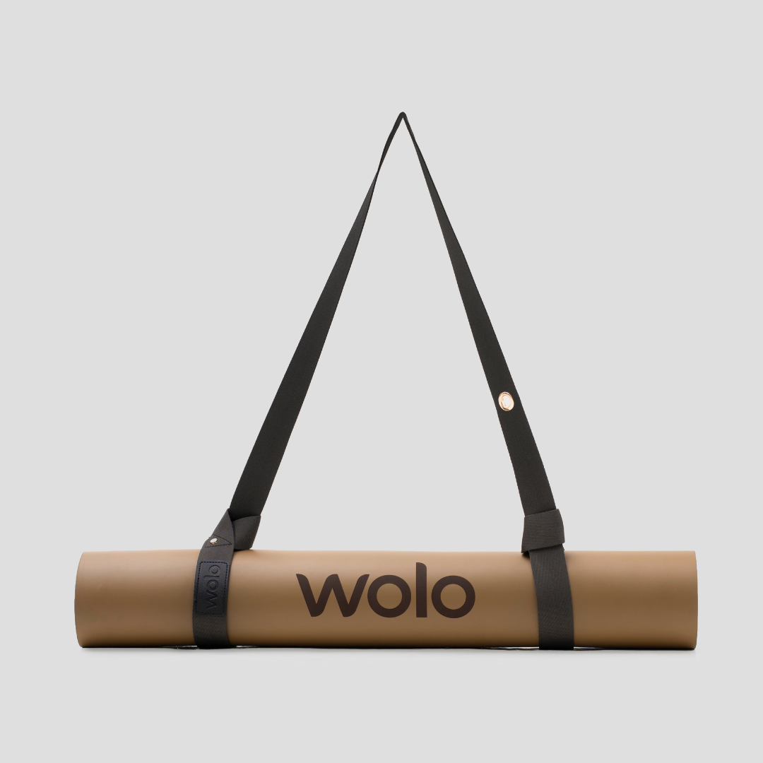 Khaki yoga mat with black strap and 'wolo' branding on a light gray background #color_ash grey