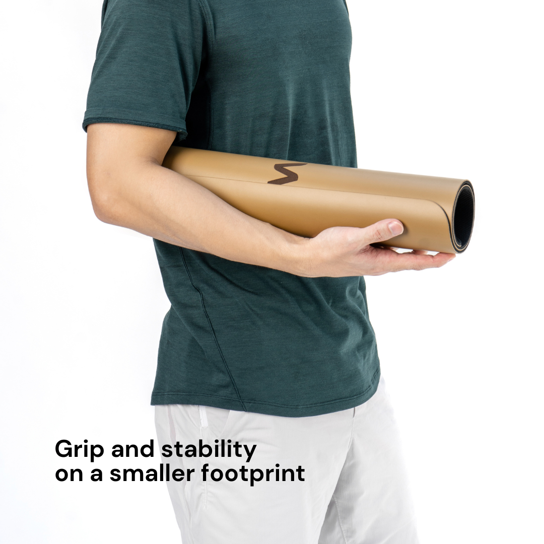 Man holding a khaki yoga pad