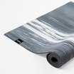 Marble-patterned yoga mat with a brand logo on a white background#color_limestone grey