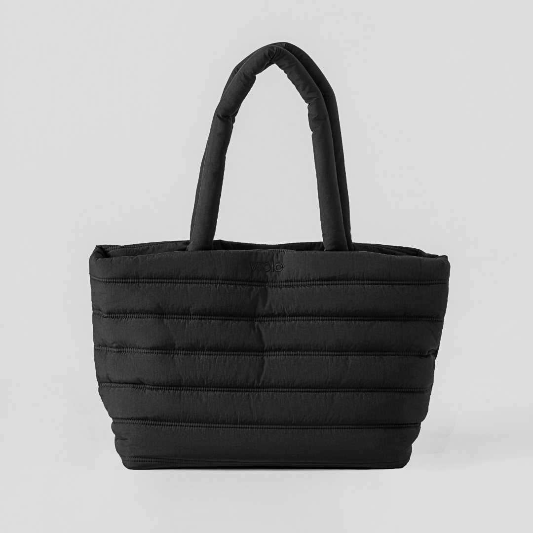 Black quilted tote bag on a light gray background#color_onyx black