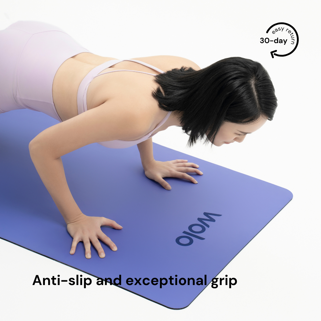 woman push-up on the lilac purple yoga mat